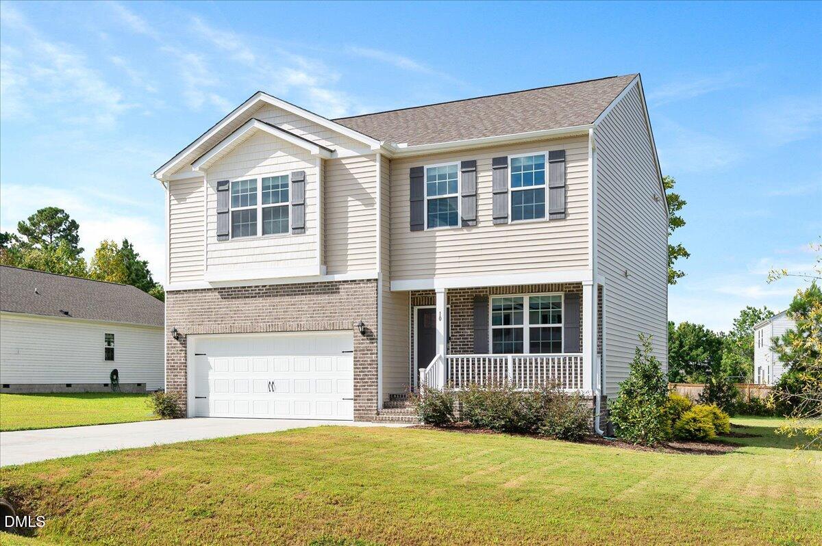 10 Whispering Willow Circle Youngsville, NC 27596 - Photo 2 of 28 a front view of a house with a yard