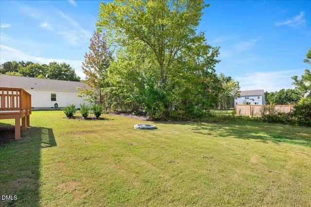 a view of a swimming pool with a yard