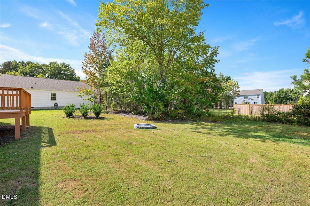 10 Whispering Willow Circle Youngsville, NC 27596 - Photo 23 of 28 a view of a swimming pool with a yard