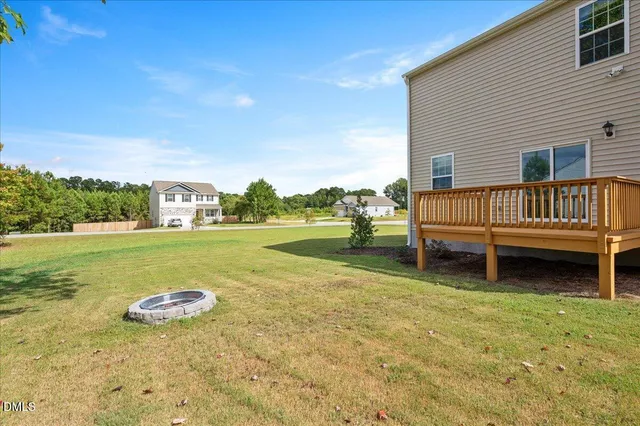 a view of a garden with lawn chairs
