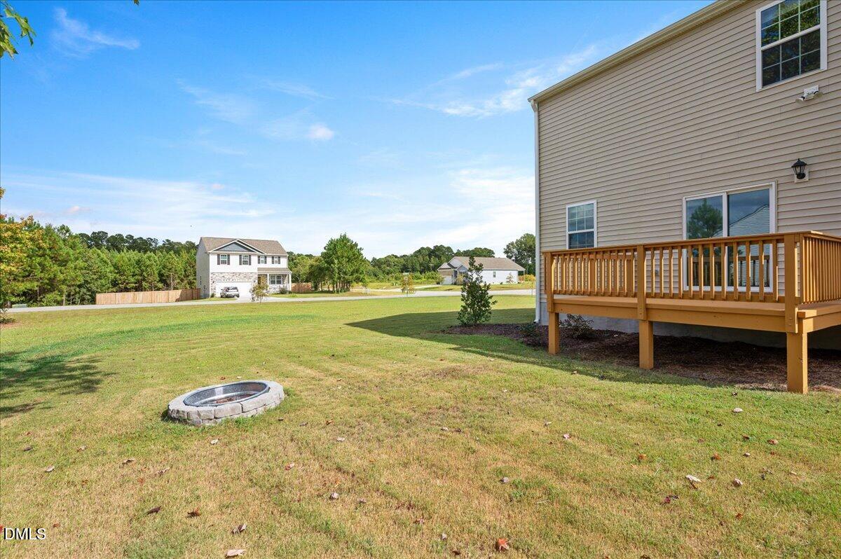 10 Whispering Willow Circle Youngsville, NC 27596 - Photo 28 of 28 a view of a garden with lawn chairs