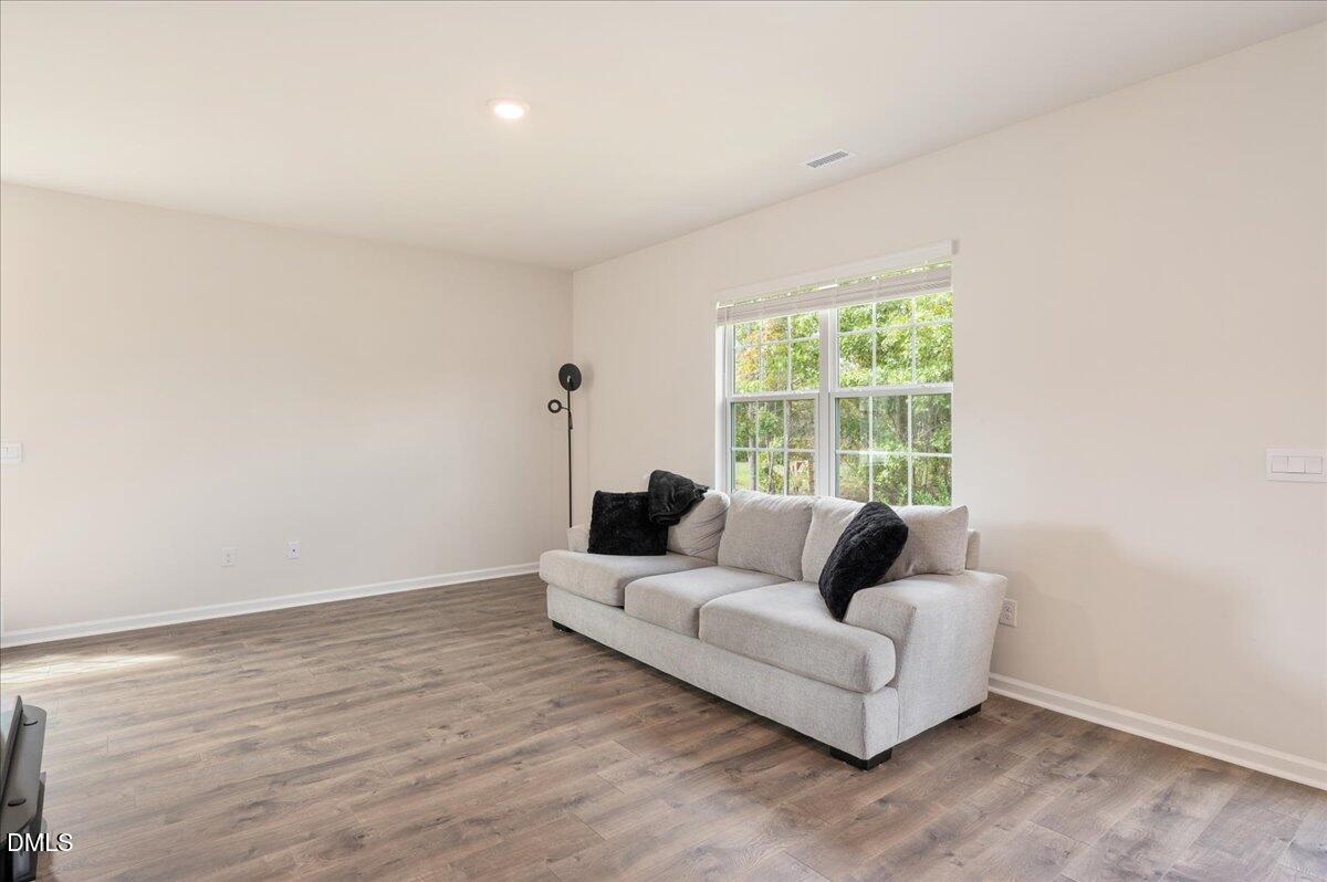 10 Whispering Willow Circle Youngsville, NC 27596 - Photo 10 of 28 a living room with furniture and a large window
