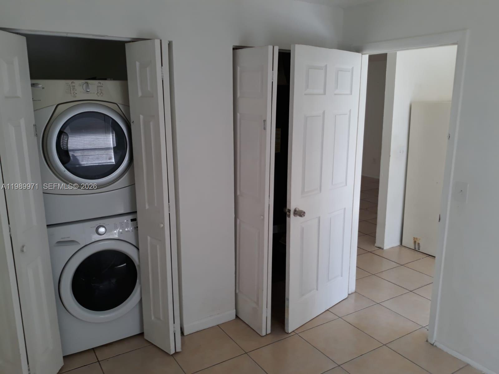 4380 Lakewood Road, Unit 4380 Lake Worth, FL 33461 - Photo 17 of 17 a view of a hallway with washer and dryer