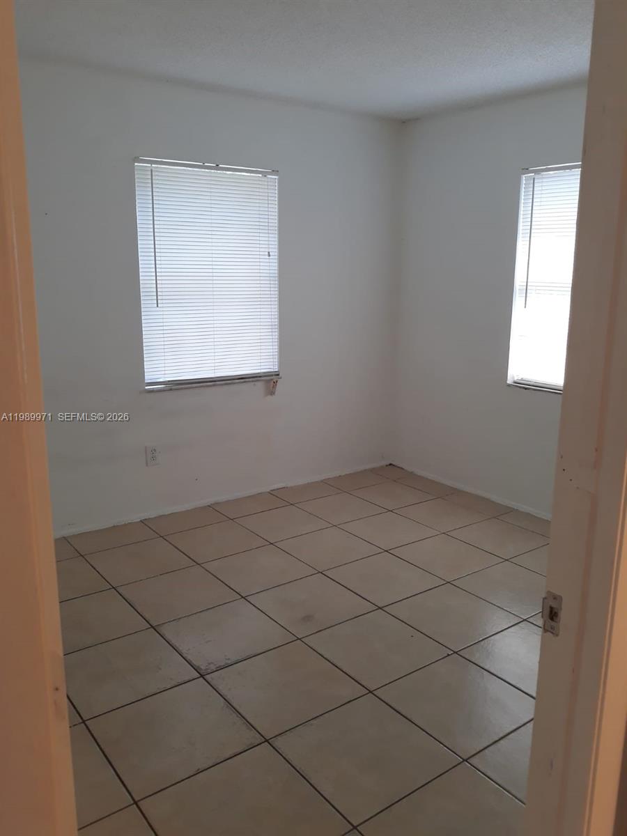4380 Lakewood Road, Unit 4380 Lake Worth, FL 33461 - Photo 9 of 17 a view of a room that has a window in it