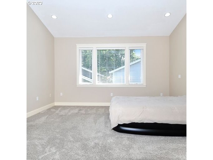 12614 Southeast Tibbetts Street Portland, OR 97236 - Photo 12 of 31 a living room with a large window
