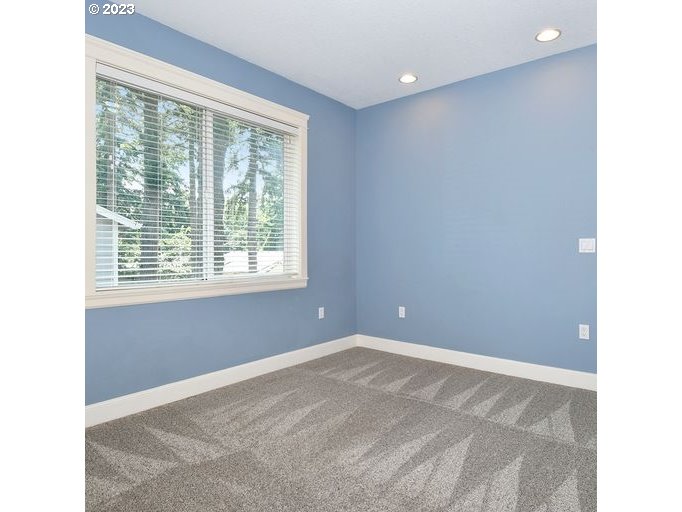 12614 Southeast Tibbetts Street Portland, OR 97236 - Photo 16 of 31 a view of an empty room with a window
