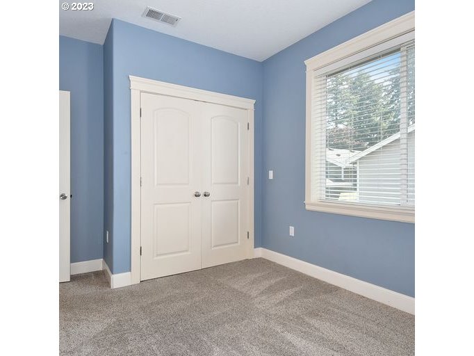 12614 Southeast Tibbetts Street Portland, OR 97236 - Photo 17 of 31 a view of an empty room with a window