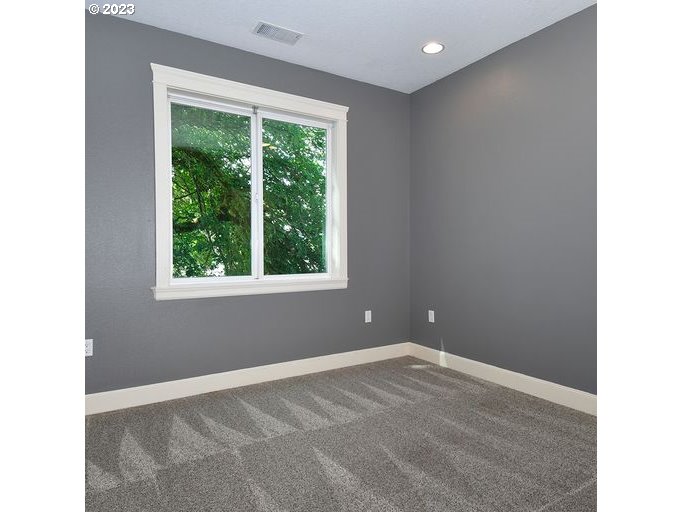 12614 Southeast Tibbetts Street Portland, OR 97236 - Photo 18 of 31 a view of an empty room with a window