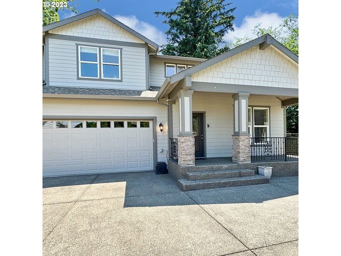 12614 Southeast Tibbetts Street Portland, OR 97236 - Photo 2 of 31 a view of a house with entrance gate