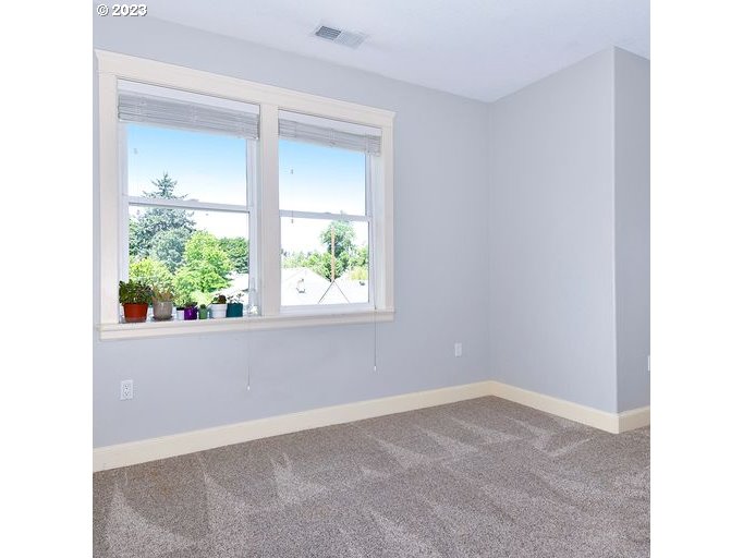 12614 Southeast Tibbetts Street Portland, OR 97236 - Photo 22 of 31 an empty room with a window