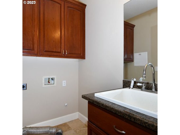 12614 Southeast Tibbetts Street Portland, OR 97236 - Photo 25 of 31 a bathroom with a sink and a mirror