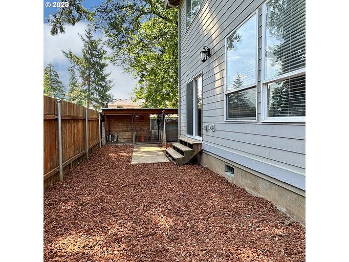 12614 Southeast Tibbetts Street Portland, OR 97236 - Photo 31 of 31 a view of a backyard with a tree