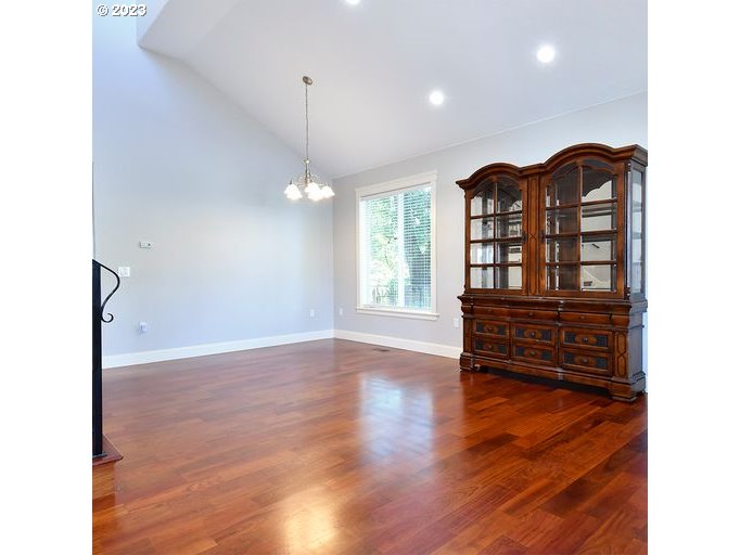 12614 Southeast Tibbetts Street Portland, OR 97236 - Photo 8 of 31 a view of a bedroom with furniture and wooden floor
