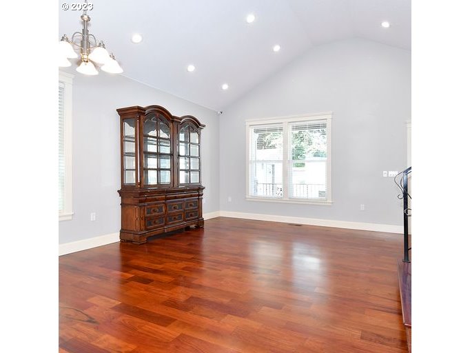 12614 Southeast Tibbetts Street Portland, OR 97236 - Photo 9 of 31 a view of empty room with wooden floor and fan