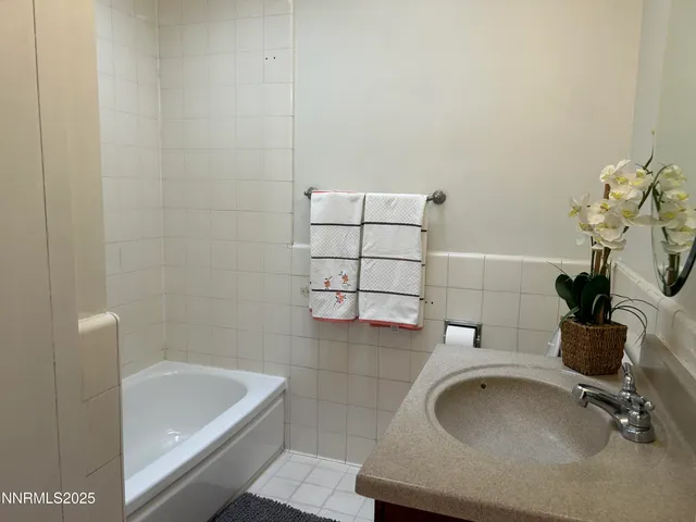 a bathroom with a sink and bathtub