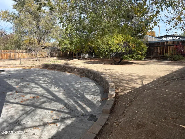 a view of open space with yard