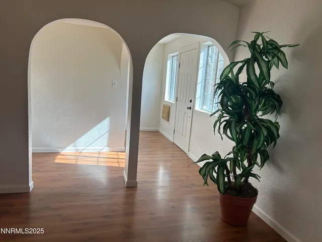 a view of a entryway with wooden floor