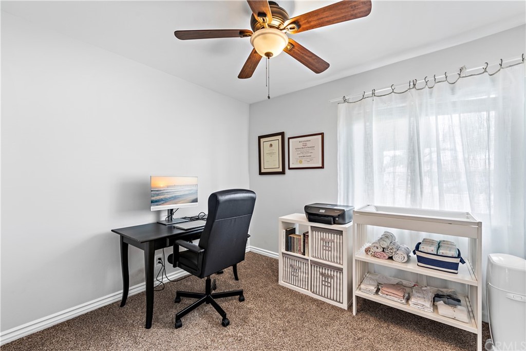 3040 Harding Way Costa Mesa, CA 92626 - Photo 14 of 17 a view of a workspace with furniture and a window