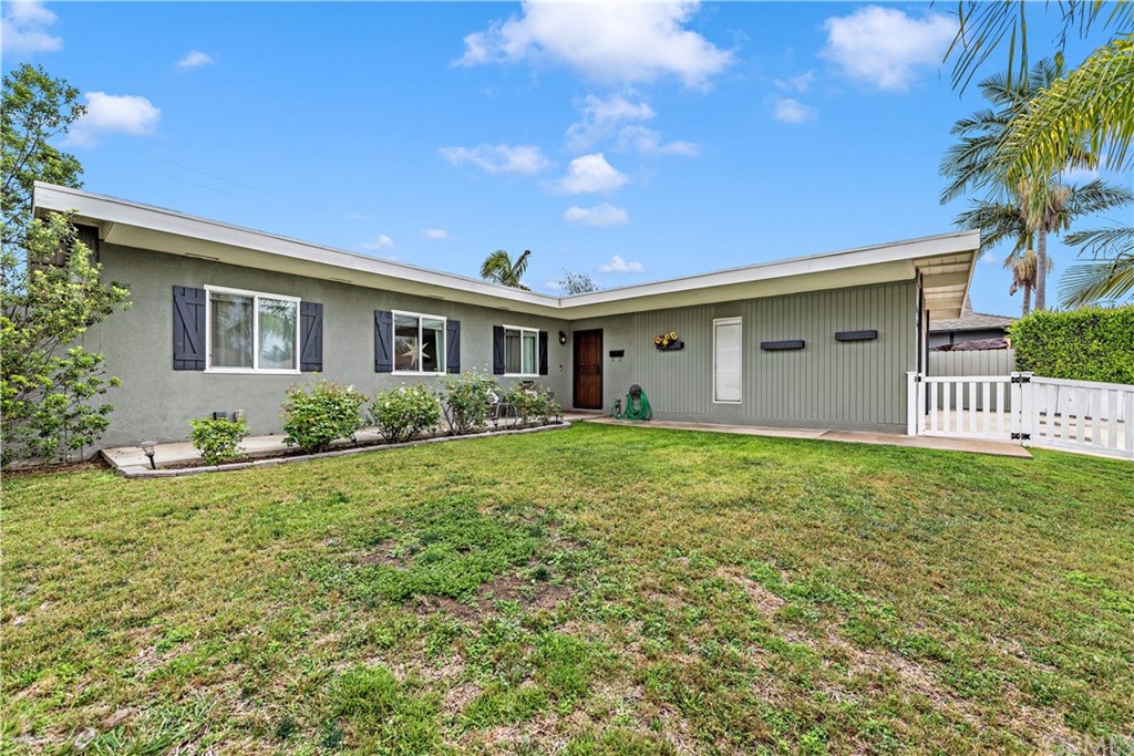3040 Harding Way Costa Mesa, CA 92626 - Photo 2 of 17 a view of an house with backyard space and garden
