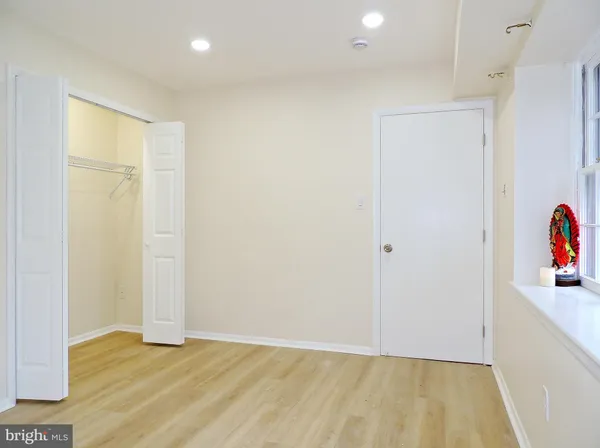a view of entryway with wooden floor