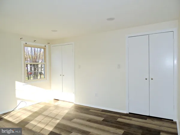 a room with a bed and a mirror