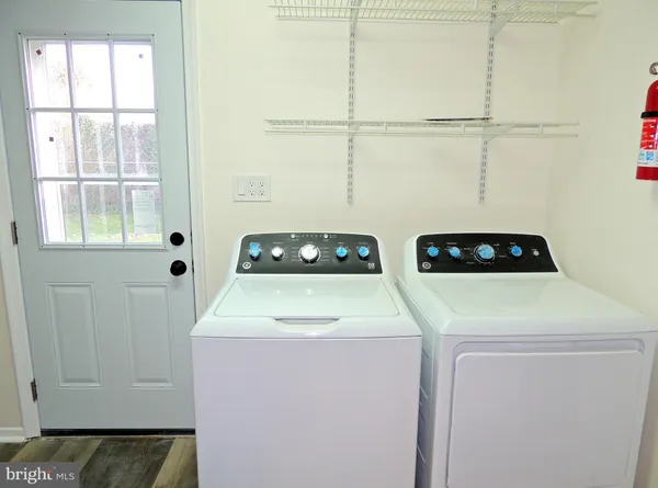 a view of backyard of house with green space