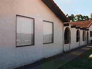 253 Gibson Canyon Road Vacaville, CA 95688 - Photo 1 of 1 a view of a house with floor to ceiling window and stairs