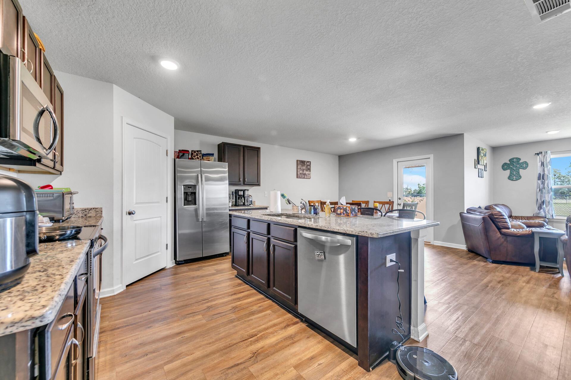 507 Merganser Way Crestview, FL 32539 - Photo 16 of 45 a large kitchen with a table and chairs in it