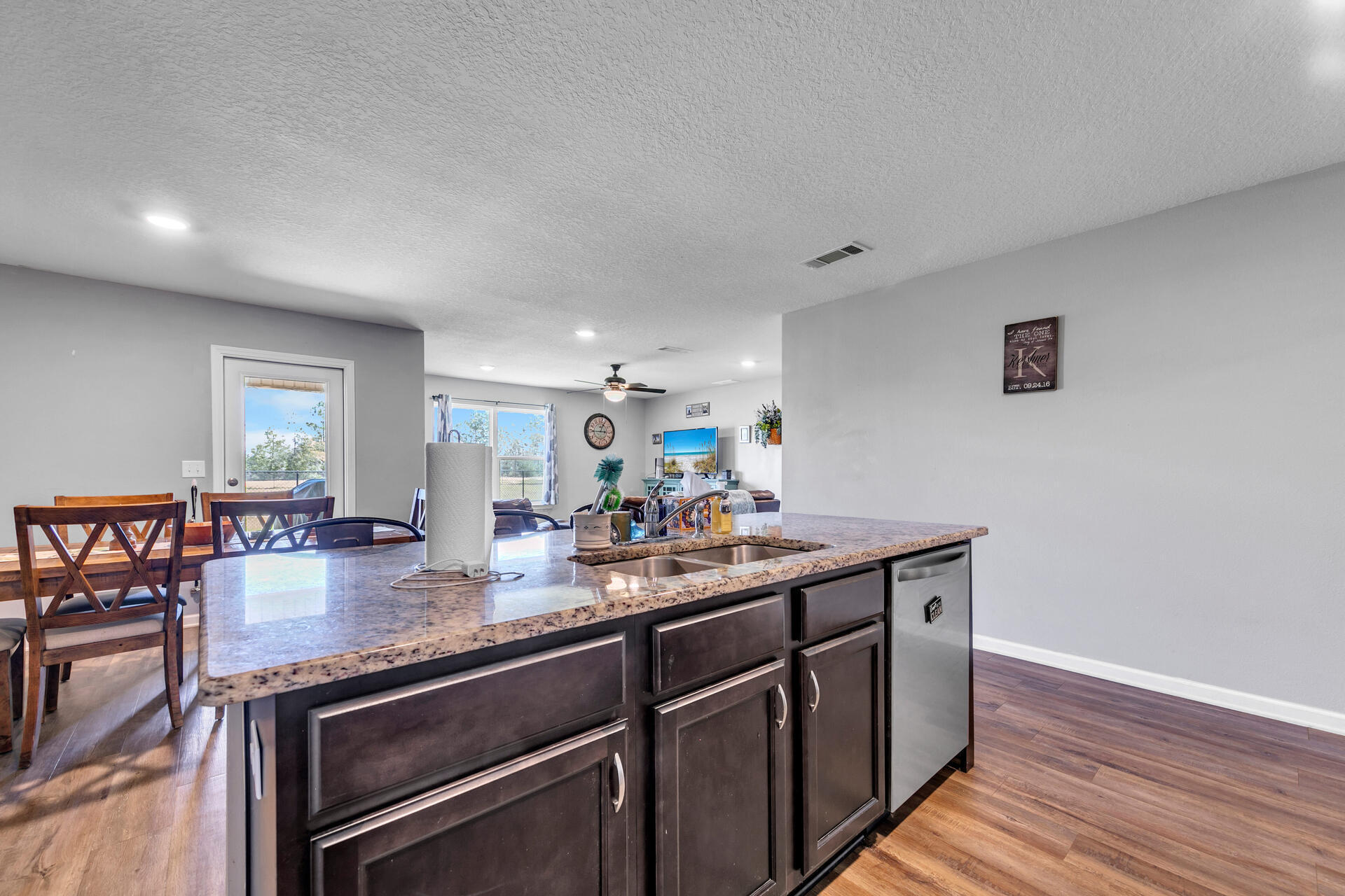 507 Merganser Way Crestview, FL 32539 - Photo 17 of 45 a kitchen with sink cabinets and wooden floor
