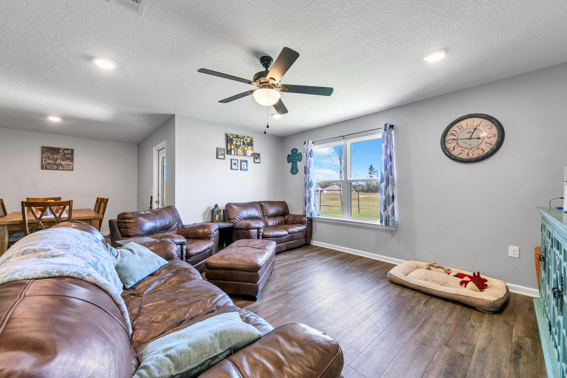 507 Merganser Way Crestview, FL 32539 - Photo 24 of 45 a living room with furniture and a wooden floor