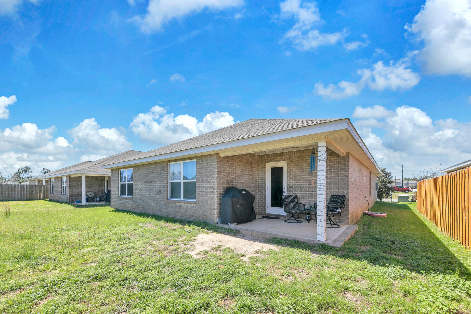 507 Merganser Way Crestview, FL 32539 - Photo 36 of 45 a view of a house with backyard and porch