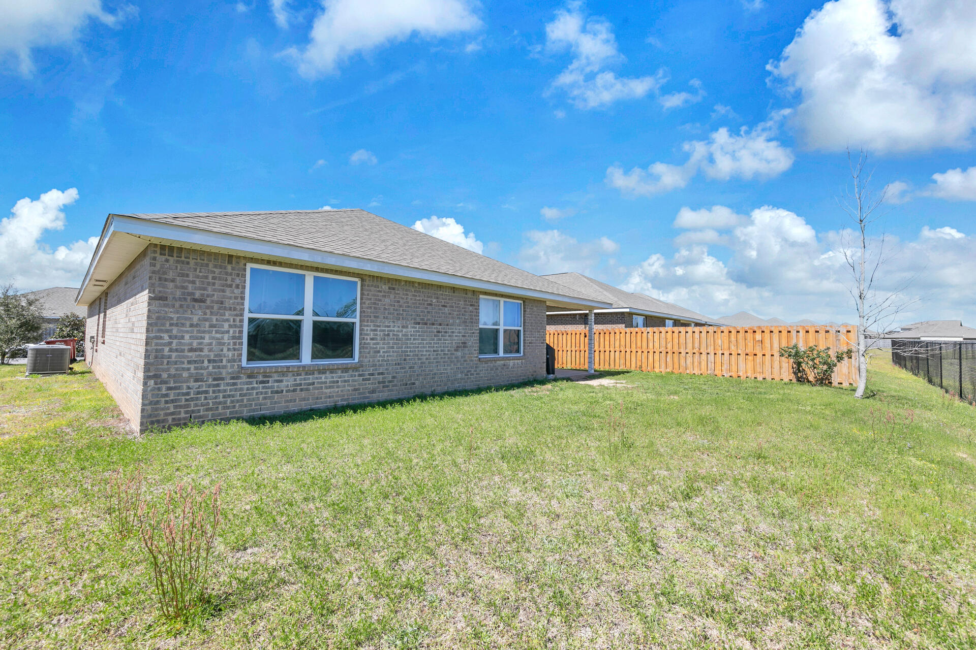 507 Merganser Way Crestview, FL 32539 - Photo 37 of 45 a backyard of a house with lots of green space