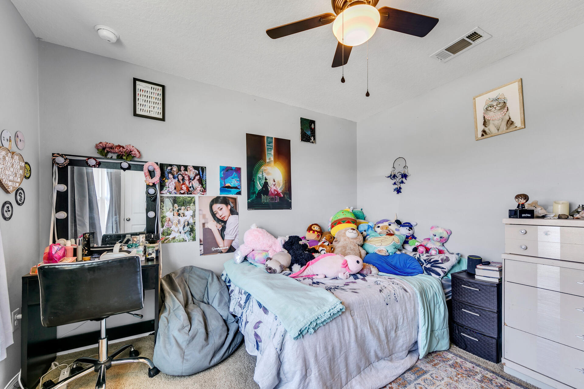 507 Merganser Way Crestview, FL 32539 - Photo 6 of 45 a bedroom with a bed and a chandelier