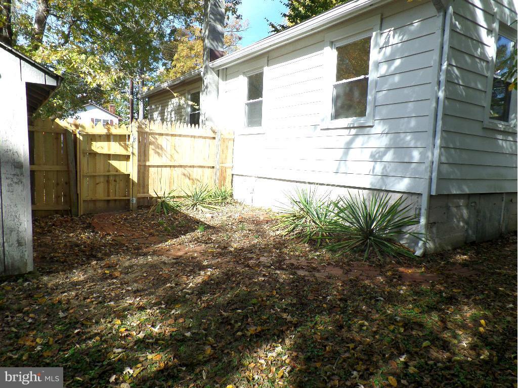 fenced yard, brick walkway