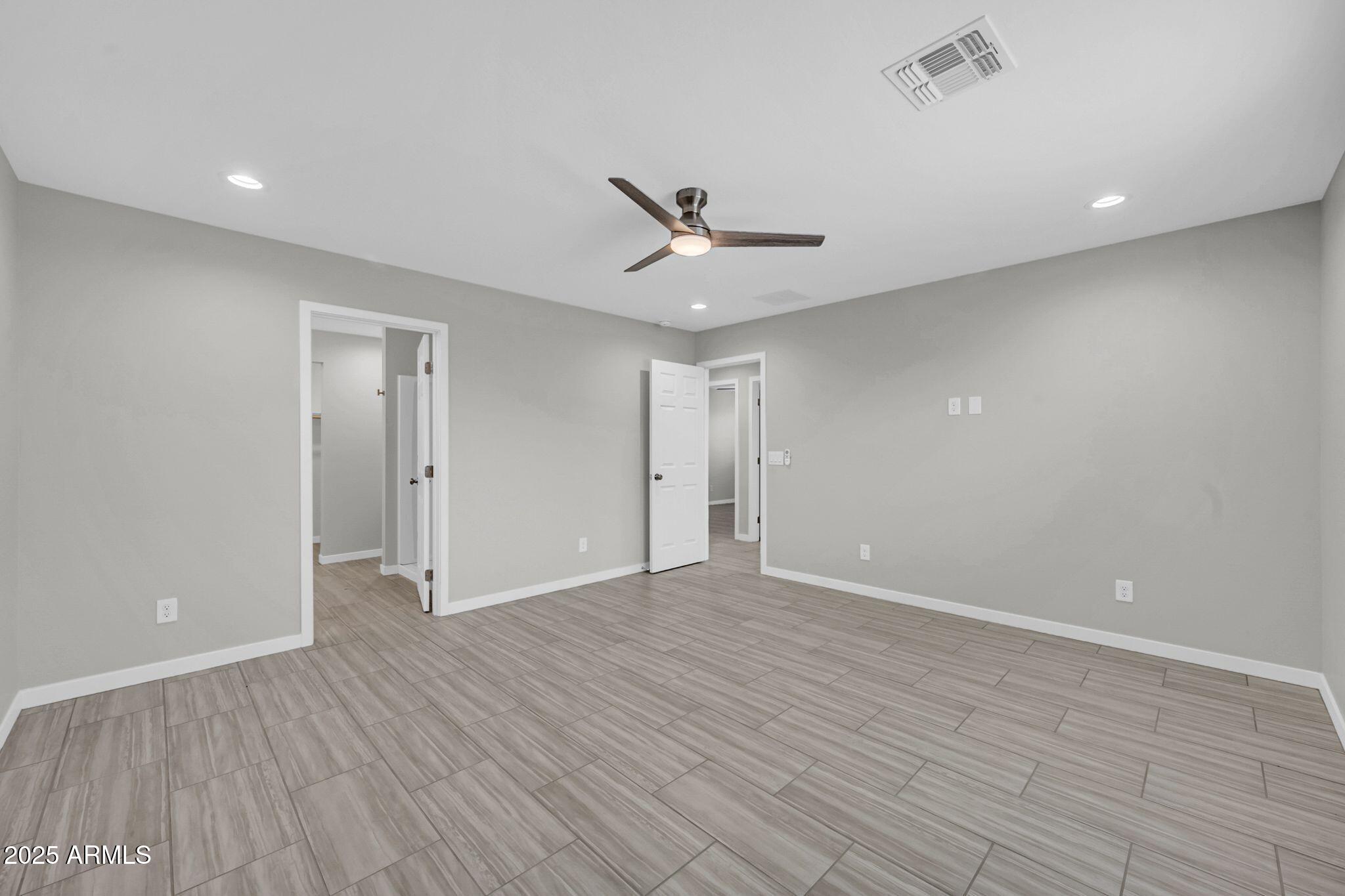 13215 South Laredo Road Arizona City, AZ 85123 - Photo 15 of 31 wooden floor in an empty room with a window