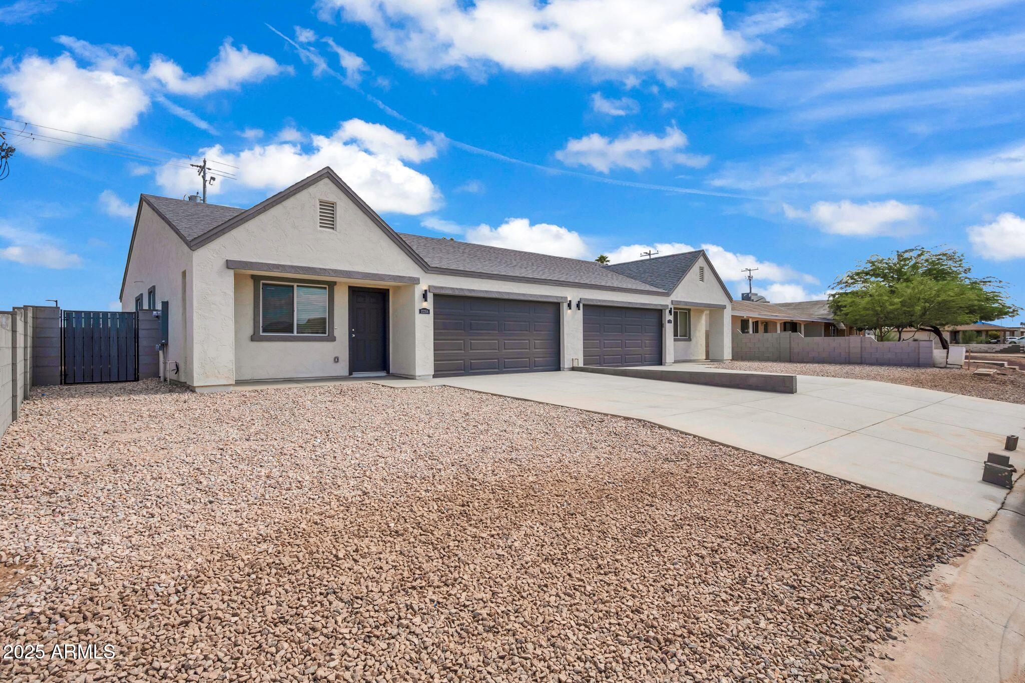 13215 South Laredo Road Arizona City, AZ 85123 - Photo 3 of 31 a front view of a house with a yard