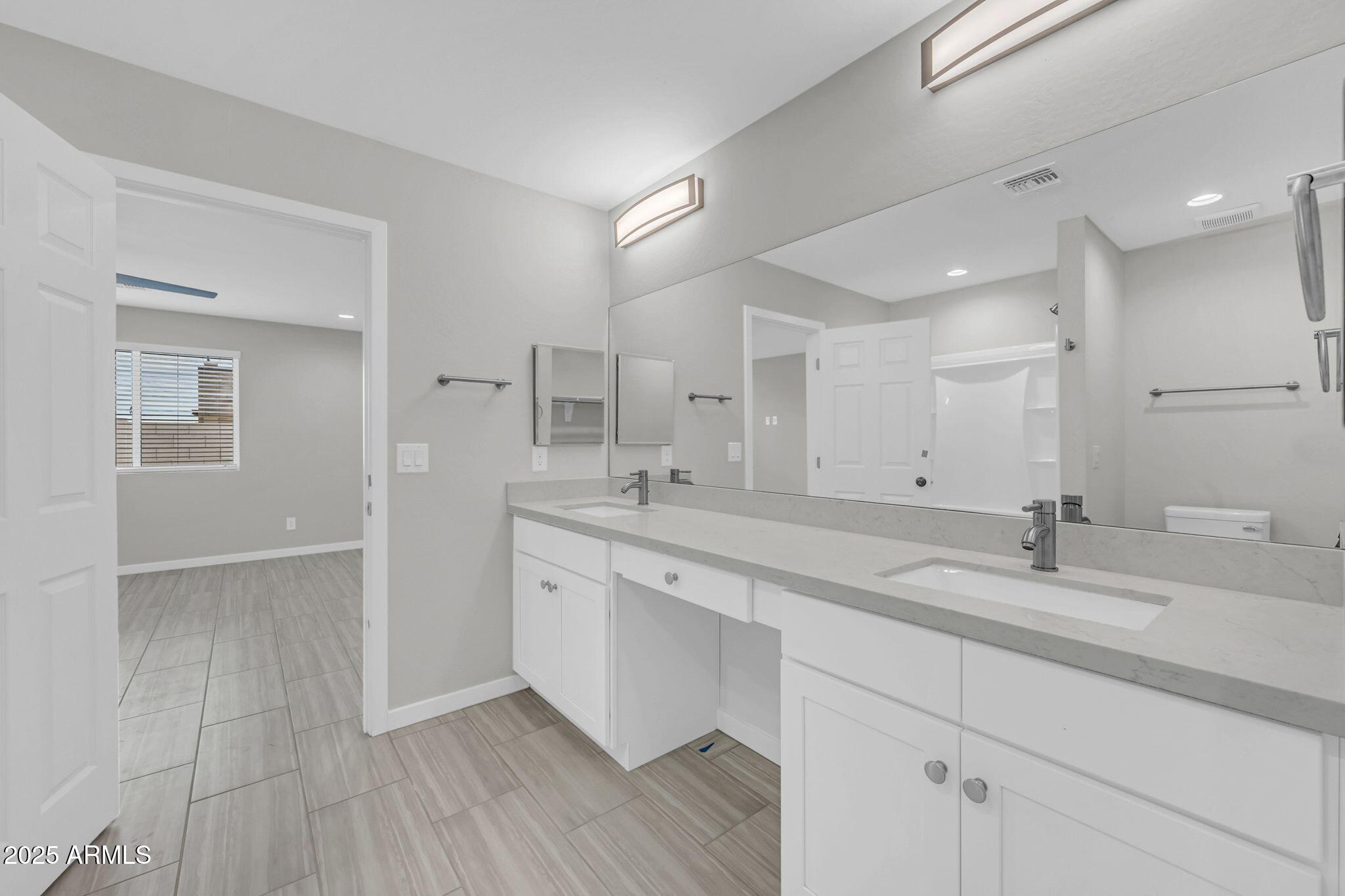 13215 South Laredo Road Arizona City, AZ 85123 - Photo 10 of 31 a bathroom with a sink and a mirror