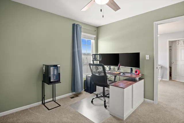 a view of a workspace with furniture