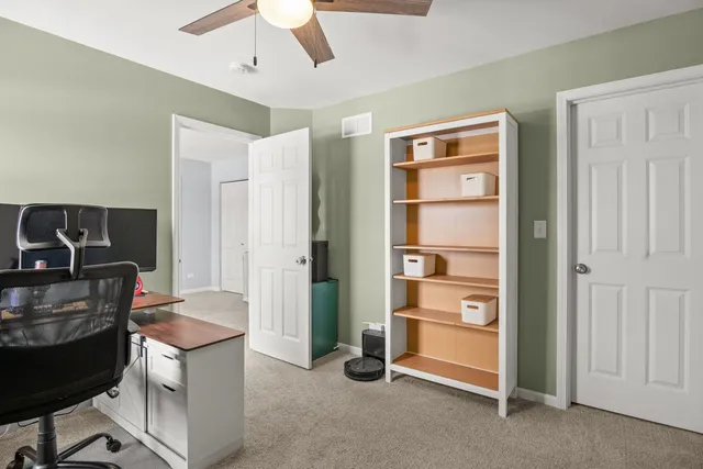 a view of a livingroom with furniture and staircase