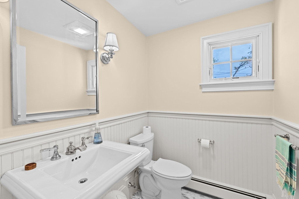 101 Nichols Road Cohasset, MA 02025 - Photo 11 of 34 a bathroom with a sink and a mirror