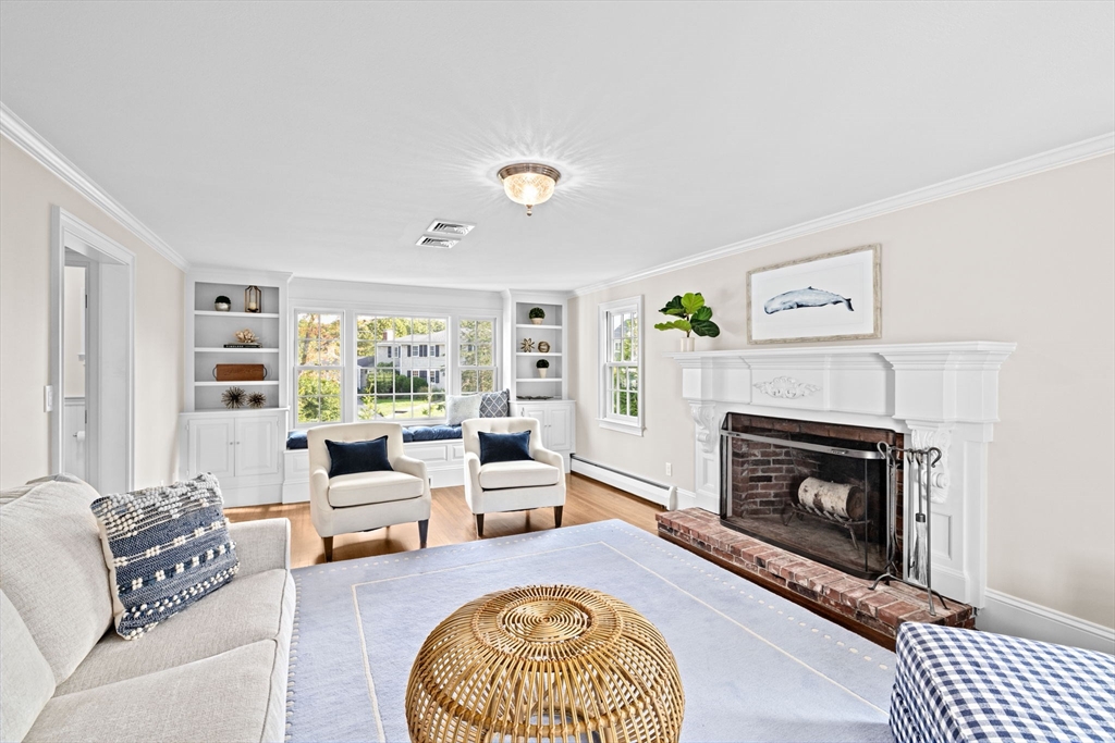 101 Nichols Road Cohasset, MA 02025 - Photo 14 of 34 a living room with furniture and a fireplace