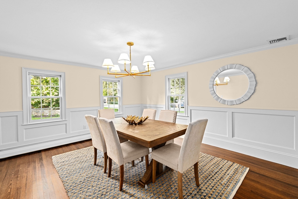 101 Nichols Road Cohasset, MA 02025 - Photo 17 of 34 a view of a dining room with furniture window and wooden floor