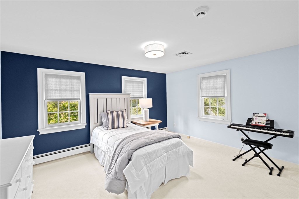 101 Nichols Road Cohasset, MA 02025 - Photo 19 of 34 a bedroom with a bed and a window