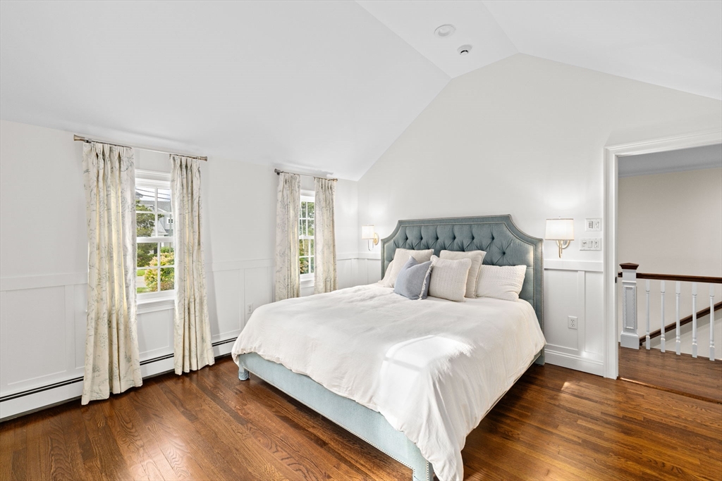 101 Nichols Road Cohasset, MA 02025 - Photo 23 of 34 a bedroom with a bed and wooden floor