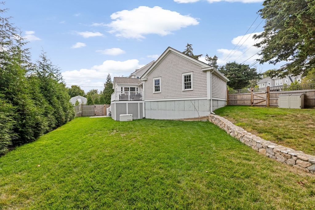 101 Nichols Road Cohasset, MA 02025 - Photo 29 of 34 a view of a house with a yard