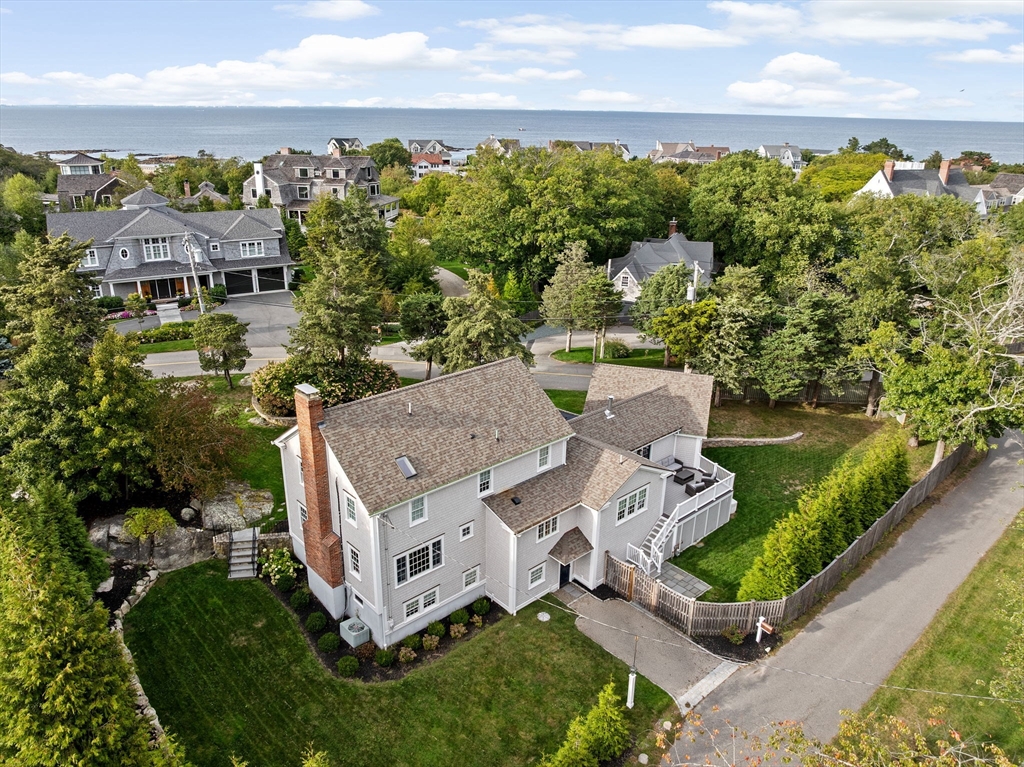 101 Nichols Road Cohasset, MA 02025 - Photo 34 of 34 an aerial view of a house with garden space and ocean view