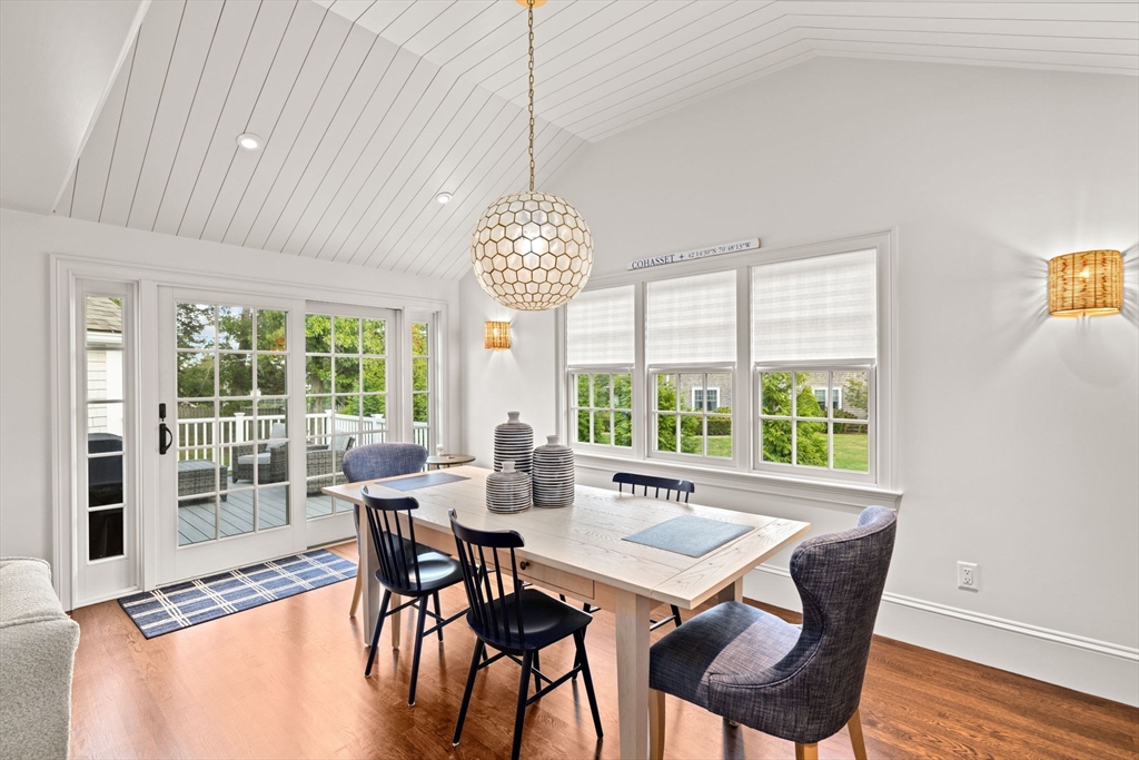 101 Nichols Road Cohasset, MA 02025 - Photo 5 of 34 a view of a dining room with furniture a chandelier and wooden floor
