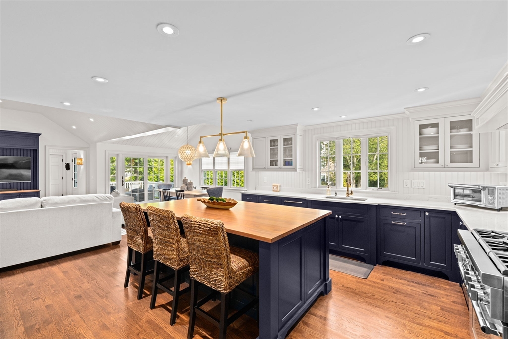 101 Nichols Road Cohasset, MA 02025 - Photo 9 of 34 a large kitchen with kitchen island granite countertop a sink and a wooden floors