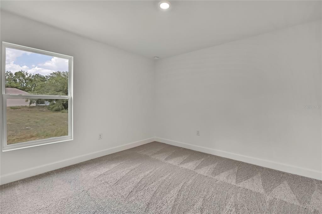 3646 Portillo Road Spring Hill, FL 34608 - Photo 10 of 16 an empty room with a window