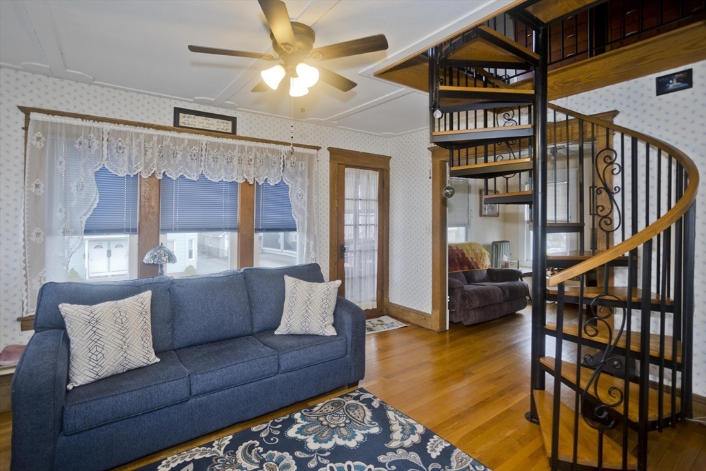 22-24 Eldridge Street Springfield, MA 01108 - Photo 13 of 41 a living room with furniture and a book shelf